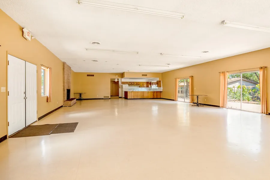 Inside the community center hall with its kitchen at the far end